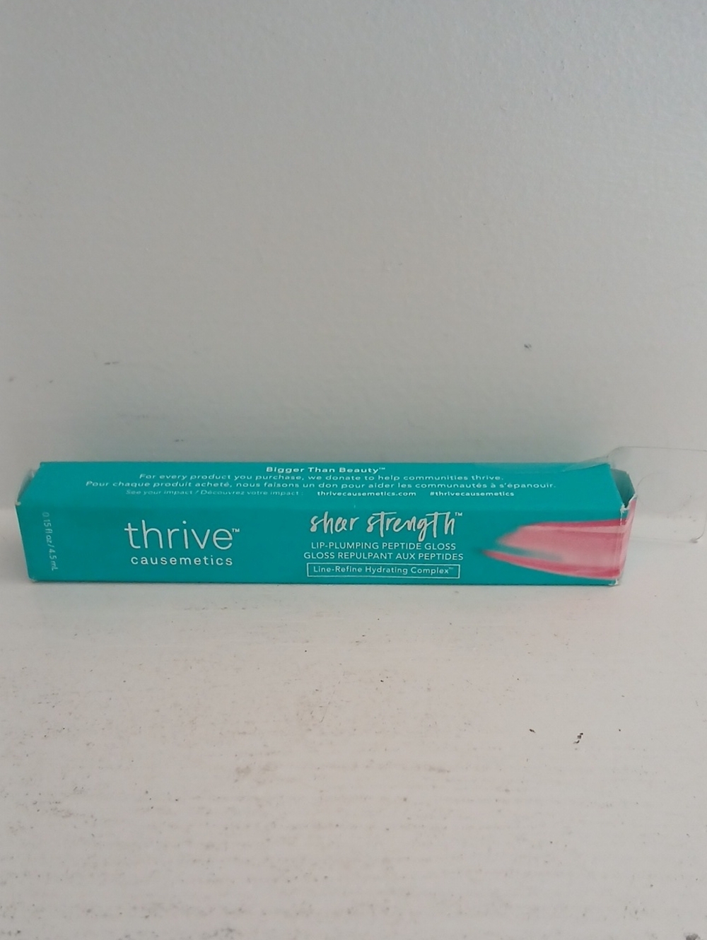 thrive Causemetics Sheer Strength Lip Plumping Gloss Maggie